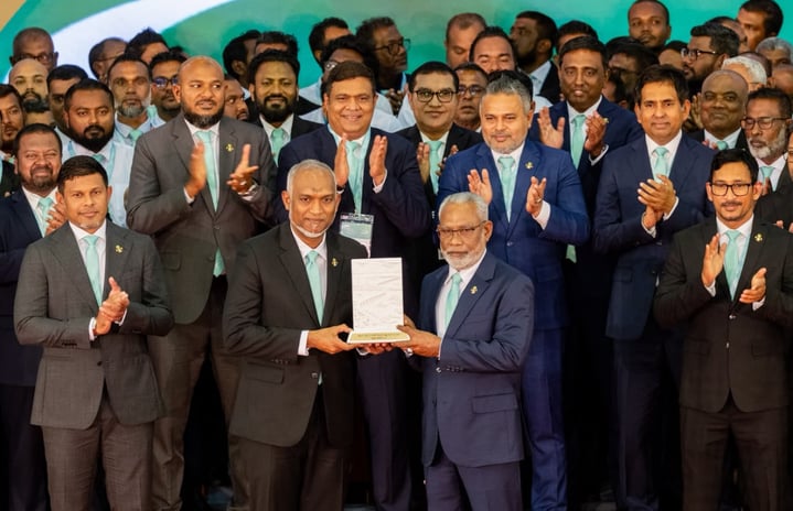 PNC Chairperson Abdul Raheem presenting the 2028 presidential ticket of the PNC to President Muizzu tonight.---Photo: Fayaz Moosa | Mihaaru