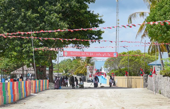 People moving about on a street in Baarah: Children have been banned from being outdoors after 9 PM on the island --- Photo: Office of the Baarah Council