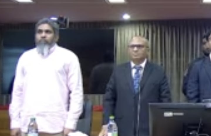 Lawyer Suood with Shifaau at Shifaau's appeal hearing --